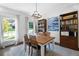 Charming dining room features hardwood floors, bright lighting, large table and a bookcase at 13 Sherman Nw Ln, Cartersville, GA 30121