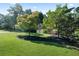 Beautiful home with lush lawn and landscaping, featuring mature trees and a brick exterior at 13 Sherman Nw Ln, Cartersville, GA 30121