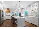 Bright kitchen featuring a central island with barstool seating, stainless steel appliances, and hardwood floors at 13 Sherman Nw Ln, Cartersville, GA 30121
