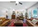 Open-concept living room boasting hardwood floors, a ceiling fan, and seamless flow to the kitchen at 13 Sherman Nw Ln, Cartersville, GA 30121
