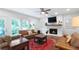Inviting living room with fireplace, TV, comfortable seating, and large windows for natural light at 13 Sherman Nw Ln, Cartersville, GA 30121