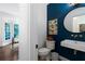Stylish powder room with a vessel sink, blue accent wall, and modern fixtures at 13 Sherman Nw Ln, Cartersville, GA 30121