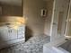 This bathroom features a white vanity with drawers and cabinets at 144 Flat Rock Rd, Oxford, GA 30054