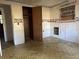 Bedroom with paneled walls, closet, and vintage wallpaper offering a charming space for renovation at 144 Flat Rock Rd, Oxford, GA 30054