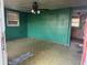 View of a living room featuring green walls, a ceiling fan, and a glimpse into the kitchen at 144 Flat Rock Rd, Oxford, GA 30054