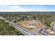 Aerial view of a new construction neighborhood with trees surrounding the property at 2540 Ravencliff Dr # 155, Austell, GA 30168