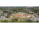 Areal view of a new construction neighborhood, showing site development and surrounding trees at 2540 Ravencliff Dr # 155, Austell, GA 30168