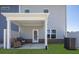 Cozy back patio featuring a covered area with two wicker chairs, ideal for relaxing outdoors at 2540 Ravencliff Dr # 155, Austell, GA 30168