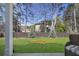 A serene outdoor scene with a view of a well-maintained lawn and natural landscaping at 2540 Ravencliff Dr # 155, Austell, GA 30168
