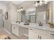 Bathroom featuring double sinks with a mirror, ample lighting, framed art and a glass enclosed shower at 2540 Ravencliff Dr # 155, Austell, GA 30168