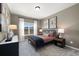 Bedroom with neutral paint, carpeted floors, window and decorative artwork at 2540 Ravencliff Dr # 155, Austell, GA 30168