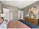 Primary bedroom featuring neutral walls, plush carpet, with a closet and dresser at 2540 Ravencliff Dr # 155, Austell, GA 30168