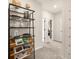 Hallway features a bookshelf, leading to other rooms with neutral paint, trim, and carpeting at 2540 Ravencliff Dr # 155, Austell, GA 30168