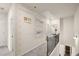 Bright upstairs hallway featuring a ceiling height ruler, carpet, and doors to bedrooms at 2540 Ravencliff Dr # 155, Austell, GA 30168
