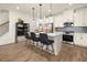 Stylish kitchen with a center island, stainless steel appliances, and sleek pendant lighting at 2540 Ravencliff Dr # 155, Austell, GA 30168