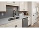 Beautiful kitchen with stainless steel dishwasher and light cabinetry at 2540 Ravencliff Dr # 155, Austell, GA 30168