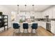 Bright kitchen with a center island, stainless steel appliances, and pendant lighting over barstool seating at 2540 Ravencliff Dr # 155, Austell, GA 30168