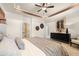 This main bedroom features neutral walls, a ceiling fan, and a framed painting above a dresser at 2540 Ravencliff Dr # 155, Austell, GA 30168