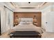 Comfortable main bedroom featuring a tray ceiling, a cozy bed and a modern bench at 2540 Ravencliff Dr # 155, Austell, GA 30168