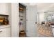 Walk in pantry with shelving, offering ample storage, next to the living room at 2540 Ravencliff Dr # 155, Austell, GA 30168