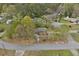 Aerial view of charming property nestled among mature trees and lush landscaping in a quiet neighborhood at 3916 S Martin Way, Lithia Springs, GA 30122