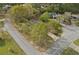 Aerial view of property on corner lot nestled among mature trees and lush landscaping in a quiet neighborhood at 3916 S Martin Way, Lithia Springs, GA 30122