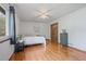 Spacious bedroom features hardwood floors, a ceiling fan, and closet at 3916 S Martin Way, Lithia Springs, GA 30122