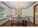 Traditional dining room with hardwood floors, decorative chandelier, and natural light at 3916 S Martin Way, Lithia Springs, GA 30122