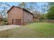 Exterior view of home with a garage, driveway, brick details and manicured lawn at 3916 S Martin Way, Lithia Springs, GA 30122
