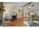 Inviting living room with a stone fireplace, hardwood floors, and comfortable seating, creating a cozy gathering space at 3916 S Martin Way, Lithia Springs, GA 30122