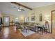 Spacious living room with hardwood floors, vaulted ceilings, and a large comfortable sofa, perfect for Gathering gatherings at 3916 S Martin Way, Lithia Springs, GA 30122