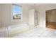Bathroom with a soaking tub, walk-in shower, and tile flooring at 5732 Falls View Dr, Buford, GA 30518