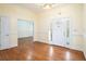 Elegant foyer boasts gleaming hardwood floors, decorative molding, and a stylish front door with glass accents at 5732 Falls View Dr, Buford, GA 30518