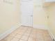 Laundry room features tile flooring and multiple hooks for hanging items at 5732 Falls View Dr, Buford, GA 30518
