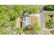 An aerial view showing the roof of a two-story home with dormer windows, and a well-kept lawn at 1010 Allenbrook Ln, Roswell, GA 30075