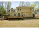 A wooden deck overlooks the backyard, providing an ideal spot for enjoying the outdoors at 1010 Allenbrook Ln, Roswell, GA 30075
