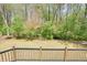 Beautiful backyard with mature trees and greenery, seen from the deck at 1010 Allenbrook Ln, Roswell, GA 30075