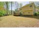 Spacious backyard featuring a wooden deck perfect for outdoor entertaining and relaxation at 1010 Allenbrook Ln, Roswell, GA 30075
