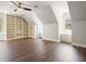 Bonus room features built-in bookshelves and a ceiling fan at 1010 Allenbrook Ln, Roswell, GA 30075