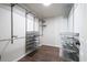 Walk-in closet with custom shelving and racks providing ample storage space at 1010 Allenbrook Ln, Roswell, GA 30075