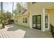 Back of house featuring a deck and access to the yard at 1010 Allenbrook Ln, Roswell, GA 30075