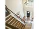 Foyer with wood staircase and black front door at 1010 Allenbrook Ln, Roswell, GA 30075