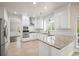 Bright kitchen featuring granite countertops, a gas stove, and stainless steel appliances at 1010 Allenbrook Ln, Roswell, GA 30075