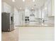 Kitchen with stainless steel appliances, granite countertops, and white cabinets at 1010 Allenbrook Ln, Roswell, GA 30075