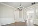 Elegant living room featuring white trim, wood floors, and natural light at 1010 Allenbrook Ln, Roswell, GA 30075