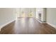 Bright living room with wood floors, fireplace, and natural lighting at 1010 Allenbrook Ln, Roswell, GA 30075