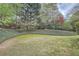 Well-maintained lawn in a lush, green backyard, enhanced by a backdrop of mature trees and natural landscaping at 4503 Payton Oaks Ne Pl, Atlanta, GA 30345
