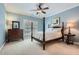Cozy bedroom with a four-poster bed, blue walls, and hardwood furnishings at 4503 Payton Oaks Ne Pl, Atlanta, GA 30345