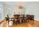 Bright dining room featuring hardwood floors, a chandelier, and classic decor for elegant dinners at 4503 Payton Oaks Ne Pl, Atlanta, GA 30345
