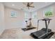 Home gym area with stationary bike, treadmill, and natural light at 4503 Payton Oaks Ne Pl, Atlanta, GA 30345